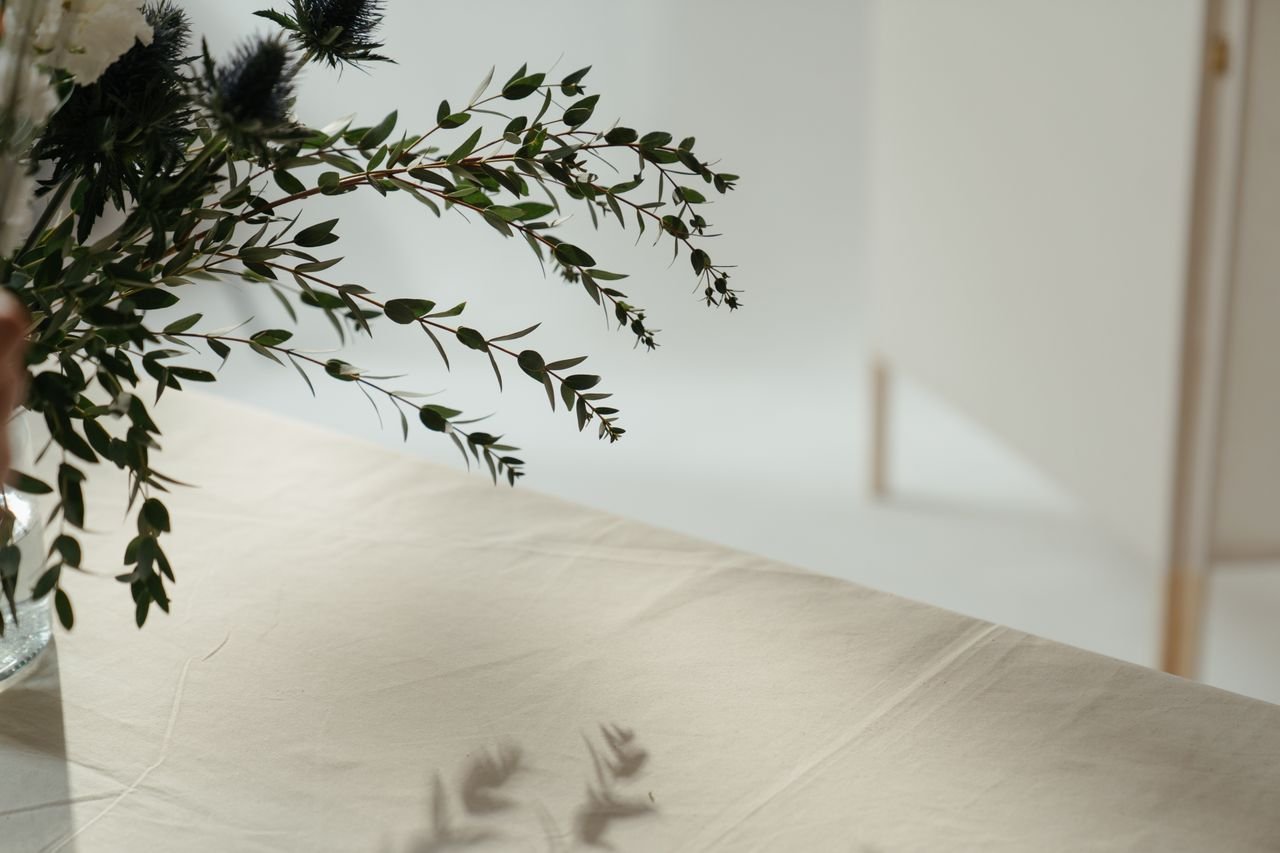 good-vibes Beautiful minimalist floral arrangement on a linen tablecloth, perfect for decor inspiration.